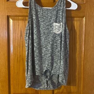 Gray and white tank top with tie, bottom and pocket at the top